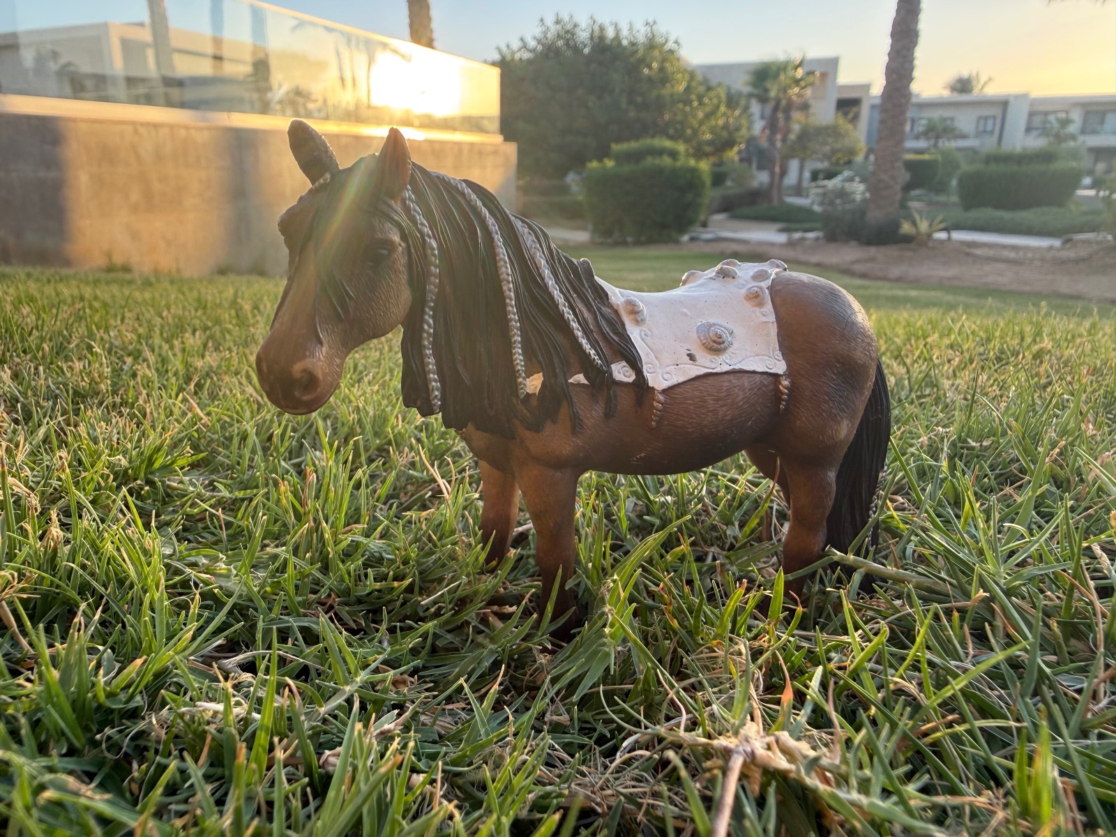 Schleich toy pony figure with decorated blanket and braided mane